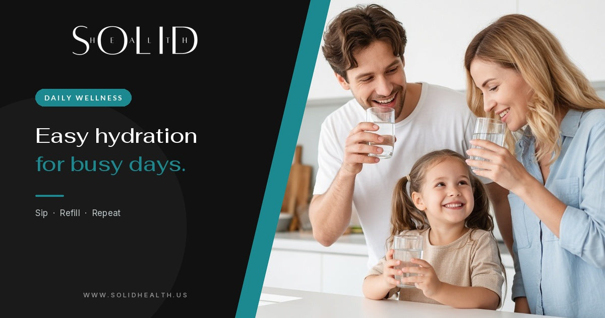 Family of three drinking glasses of water together in a kitchen