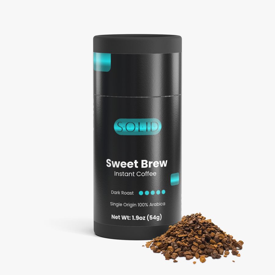 Solid Health Sweet Brew Instant Coffee tube with a small pile of freeze-dried instant coffee granules in front