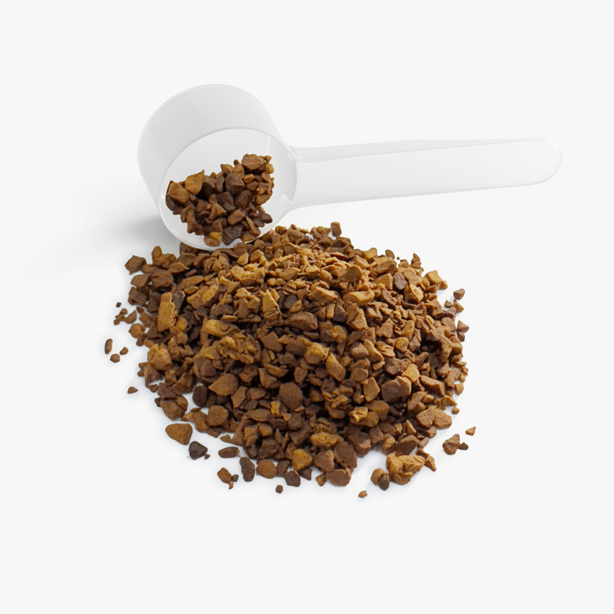 Close-up of freeze-dried instant coffee granules with a white measuring scoop